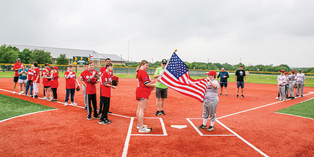 Brynli Carder and Waytt Childs hold the flag during the National Anthem. Photos by NICHOLAS SAKELARIS