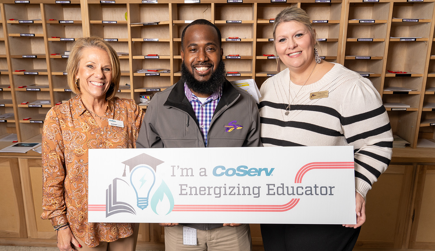 CoServ presents an Energizing Educator award to the Career and Technology Teacher at Sanger High School, Mr. Laytric Lewis. Pictured ( L to R) CoServ Manager of Academic Initiative Whitney Gohlke, Sanger HS Career and Technology Teacher Laytric Lewis, Sanger HS Principal Carly Sperry.