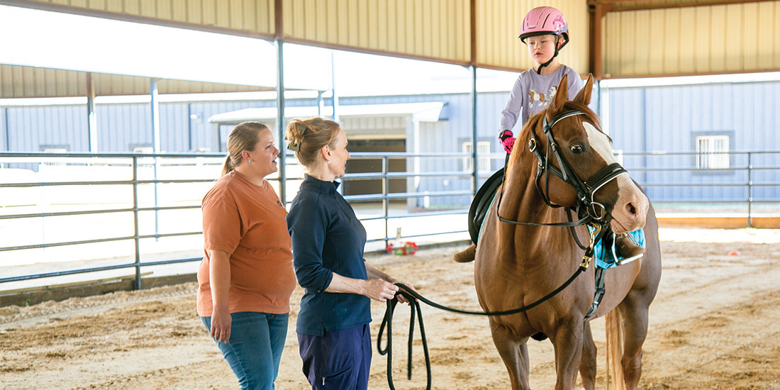 Jennifer Mathis, EquiHope Program Director and co-founder, directs Blake Blanchard on what commands to give her horse, Oscar. Photos by NICHOLAS SAKELARIS