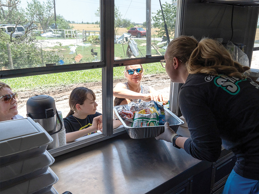 CoServ's Snackin' Wagon was on the scene handing out food and water to
first responders and residents in the affected area. Photo by BRIAN ELLEDGE