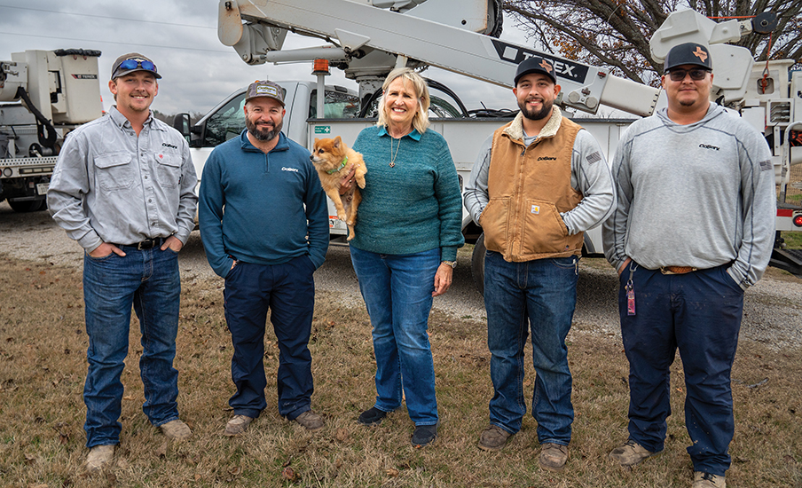 CoServ Member Jo Ann Ream meets the CoServ linemen who helped restore power to her area after a bad lightning storm last October. Pictured (L to R) Dillon Hodge, Santiago Dominguez, Jo Ann Ream, Jesse Median, Mitchell Para.